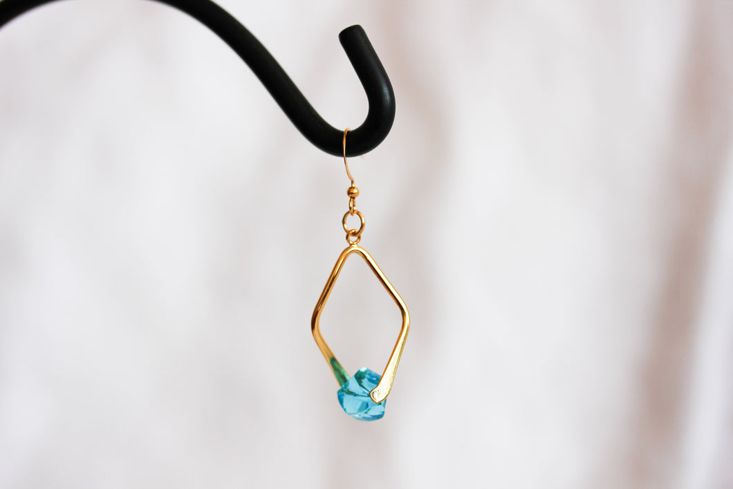 Twisted angle earrings - gold with turquoise blue crystals