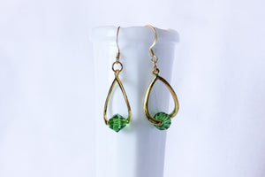 Curvy earrings - gold with forest green crystal