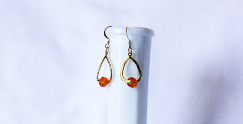 Curvy earrings - gold with burnt orange crystal