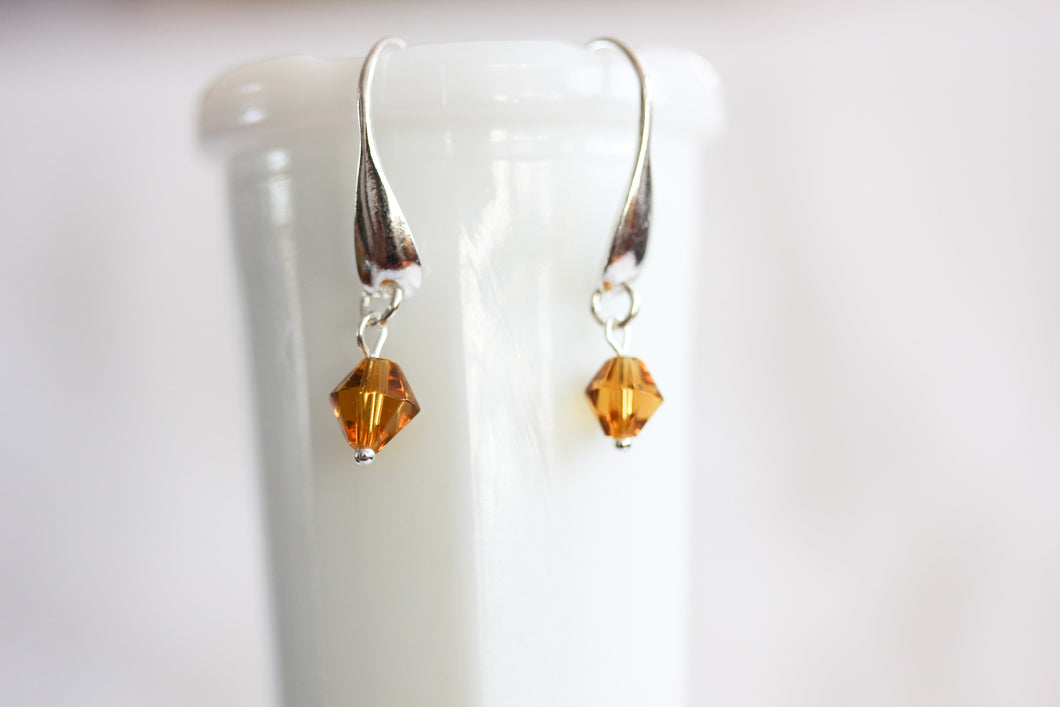 Sterling silver drop earrings - orange crystals
