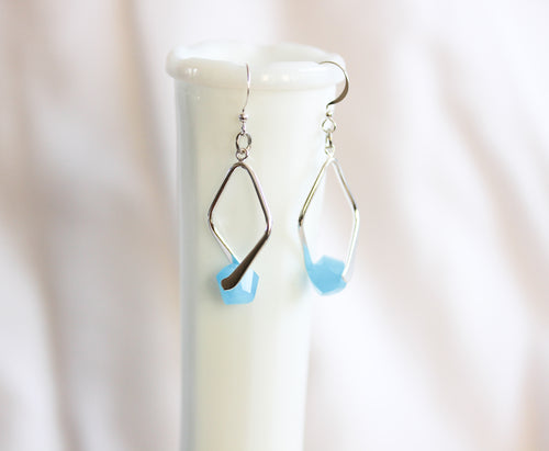 Twisted angle earrings - silver with sky blue crystals